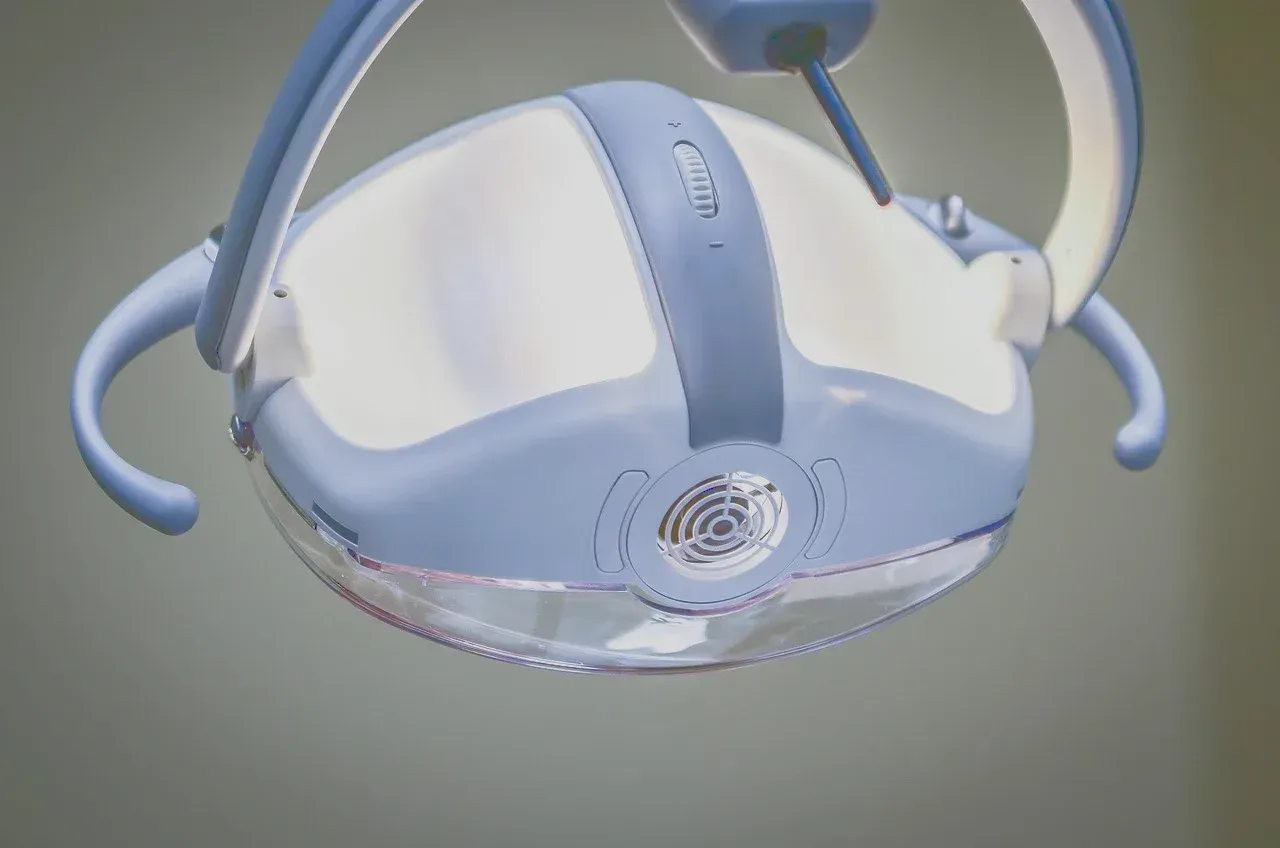 An examination lamp above a clinical chair